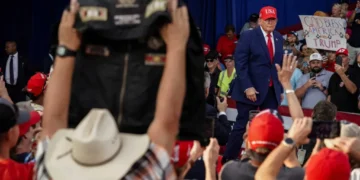 Protesters dragged out of Trump rally as president erupts over repeated disruptions