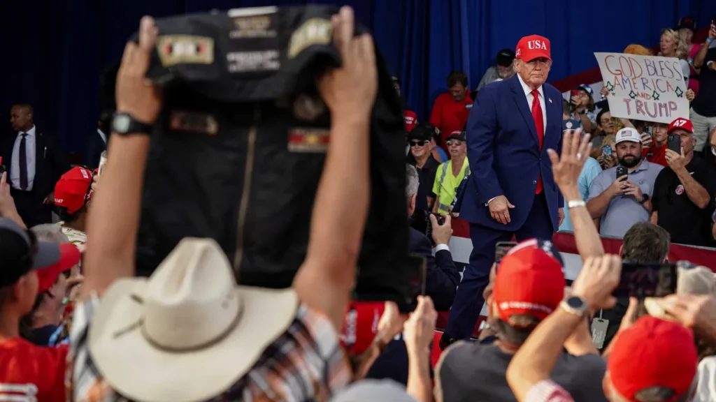 Protesters dragged out of Trump rally as president erupts over repeated disruptions