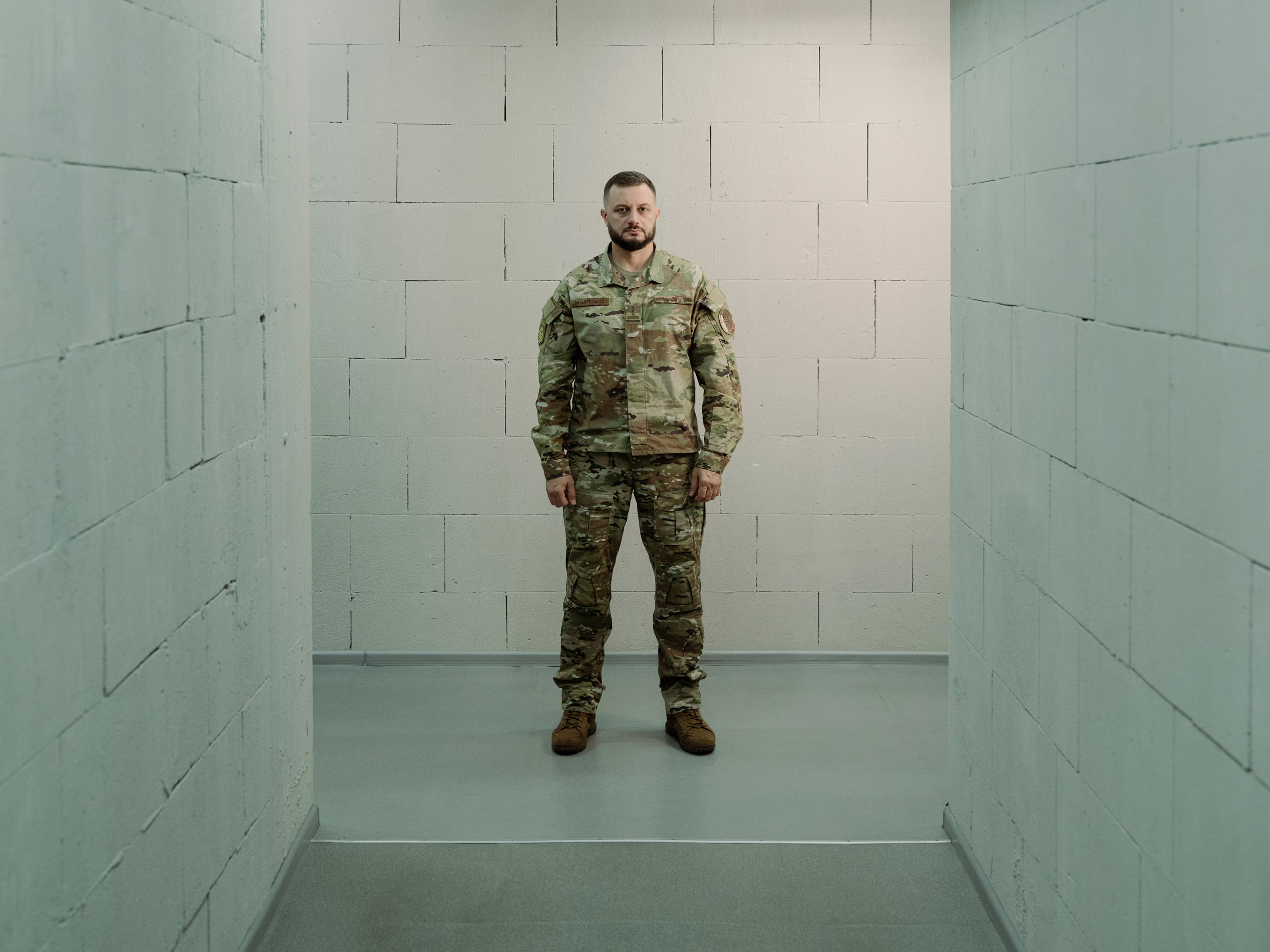 a soldier stands in a hallway