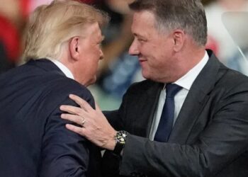 Audi CEO Gernot Döllner appears on stage with Trump at a Republican campaign rally to announce a new car factory in Georgia