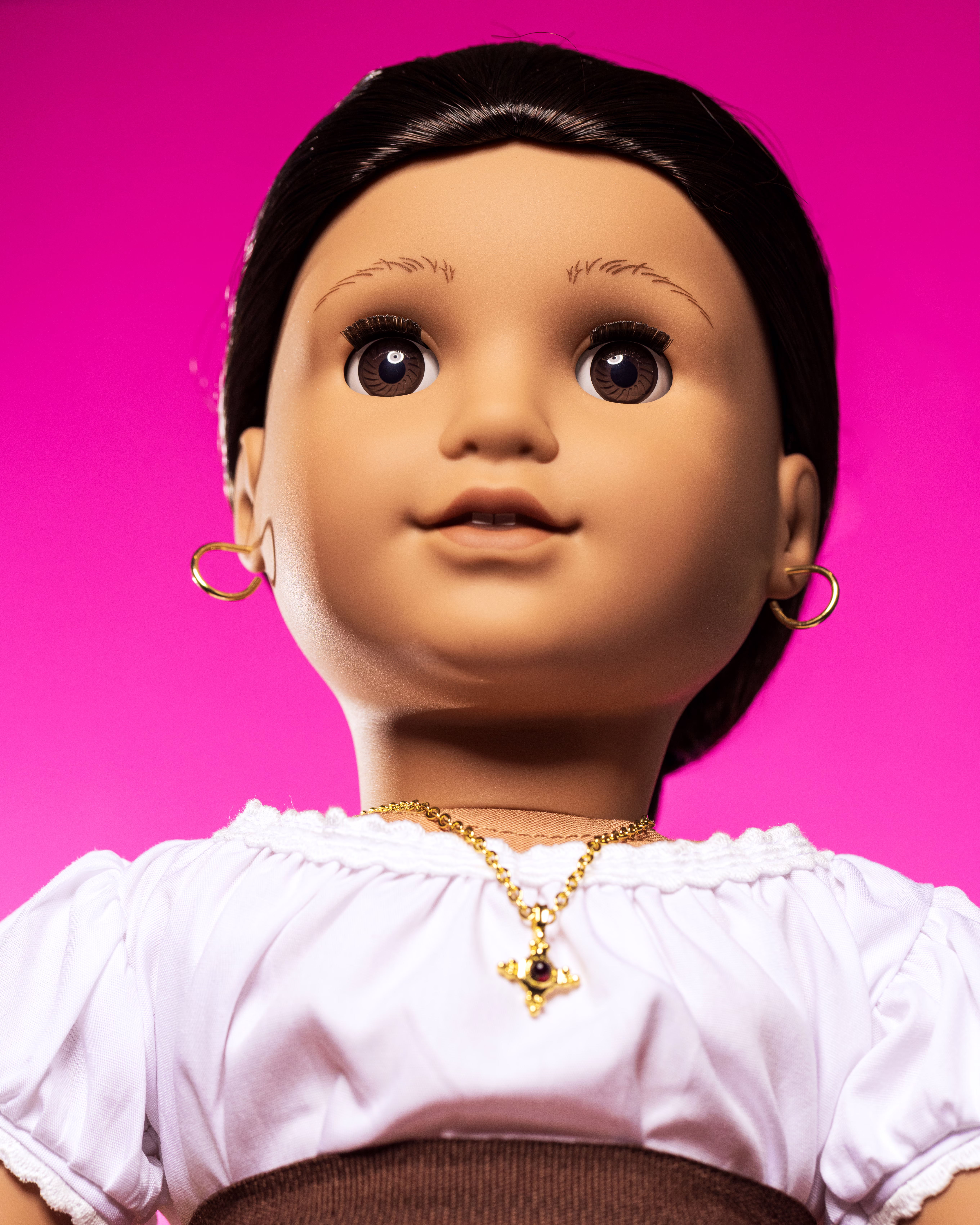 photo of Josefina doll on pink background