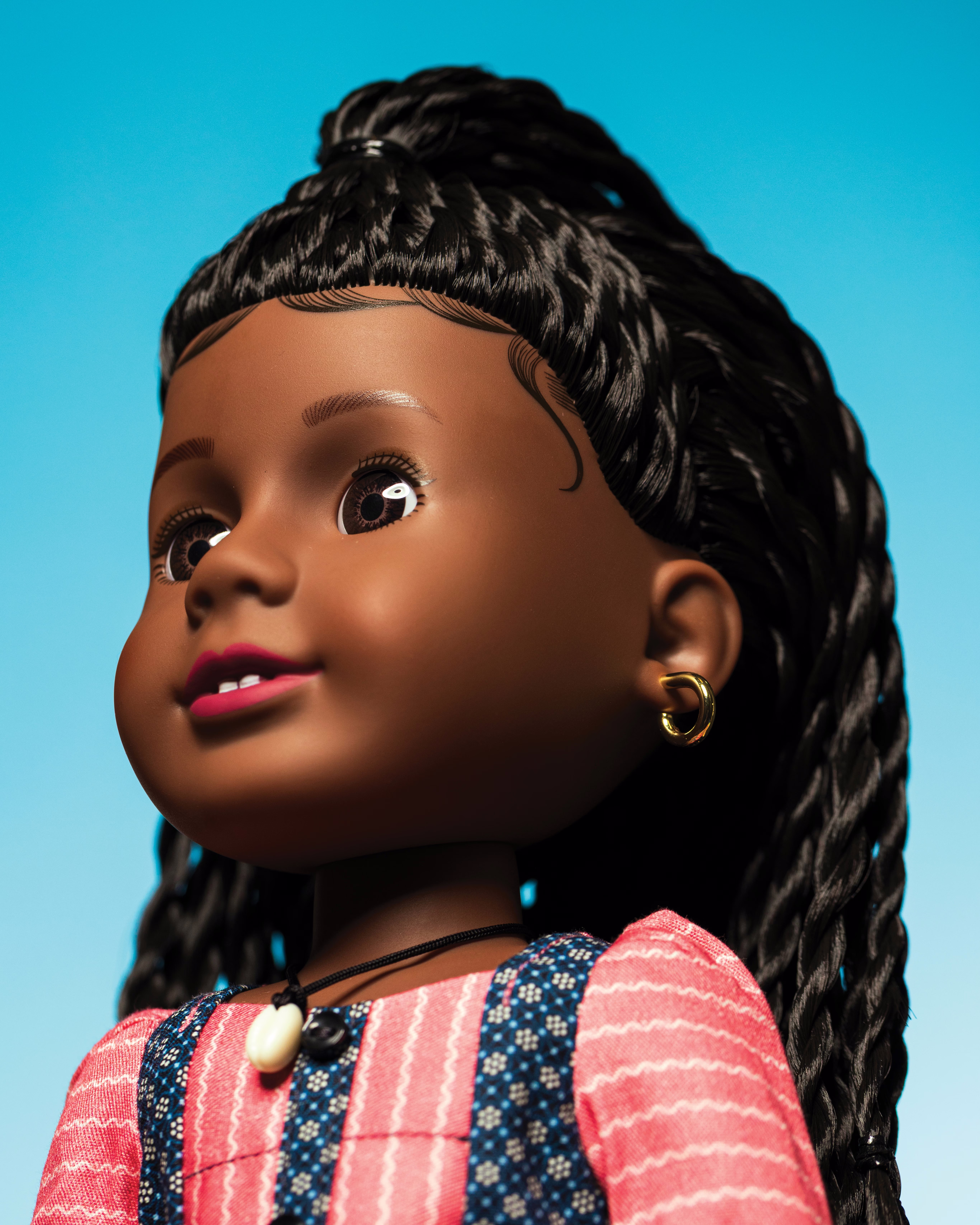 photo of Addy doll on blue background