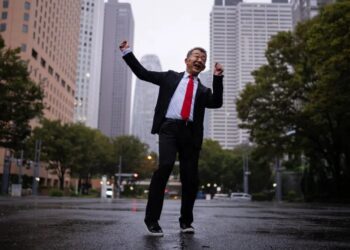 Rain or Shine, Japan’s ‘Dancing Salaryman’ Can’t Stop Grooving