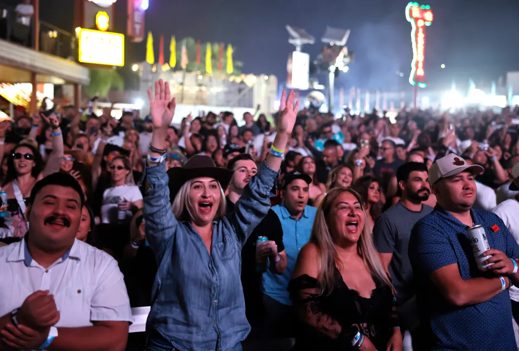 Visitors cheering at the Big Fresno Fair.