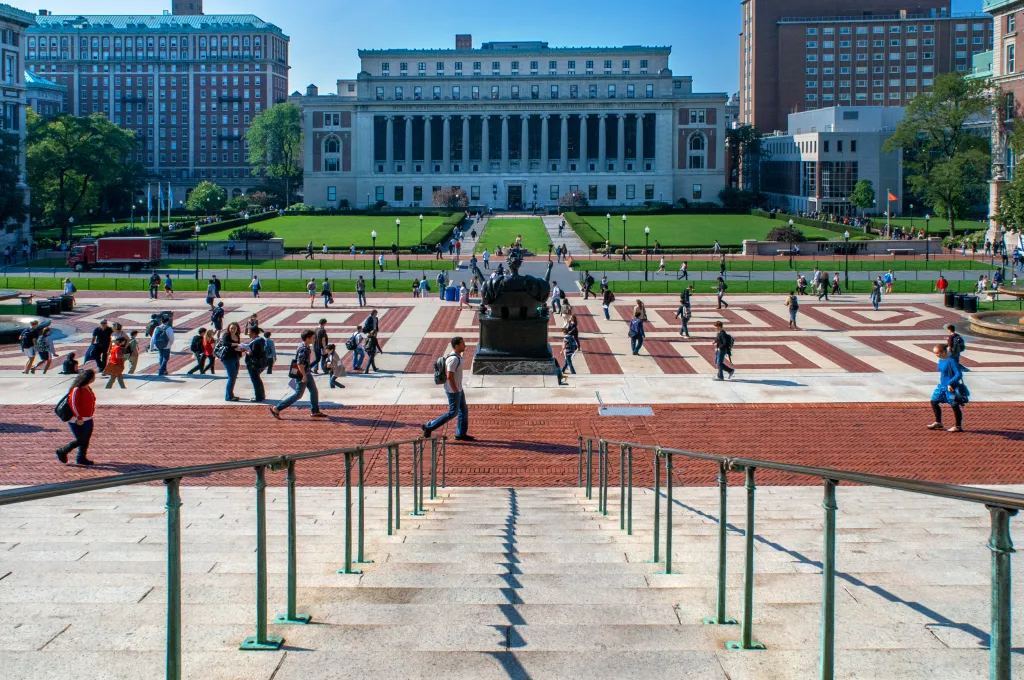 Students roam the esplanade in front of the Low Memorial Library at Columbia University.
