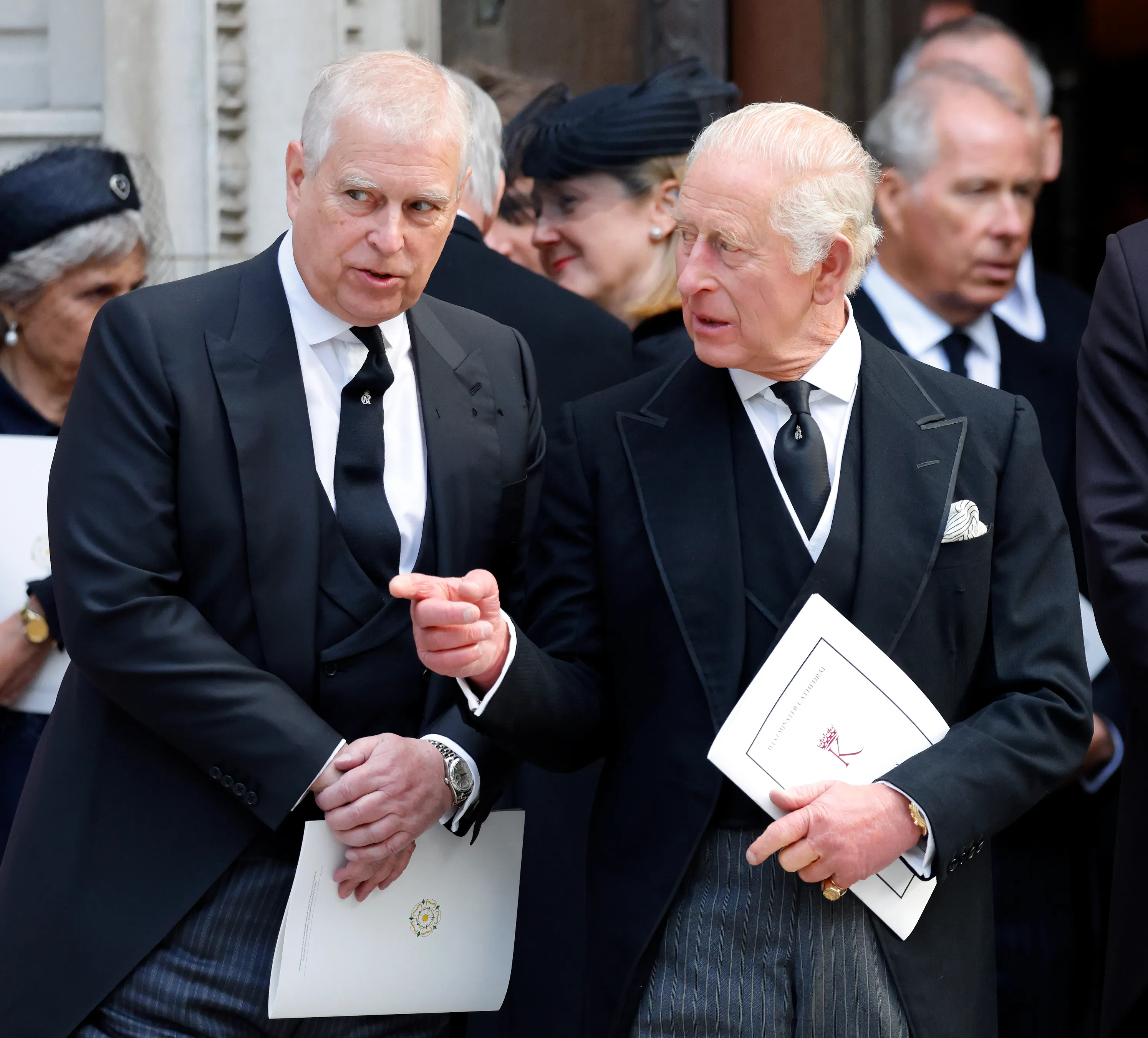 Prince Andrew and King Charles III attend a funeral service at Westminster Cathedral.