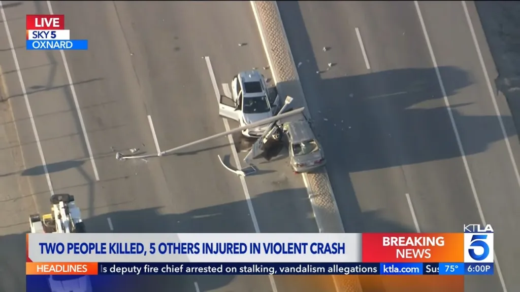 An aerial view of the crash site in Oxnard, showing damaged cars and a fallen light pole.