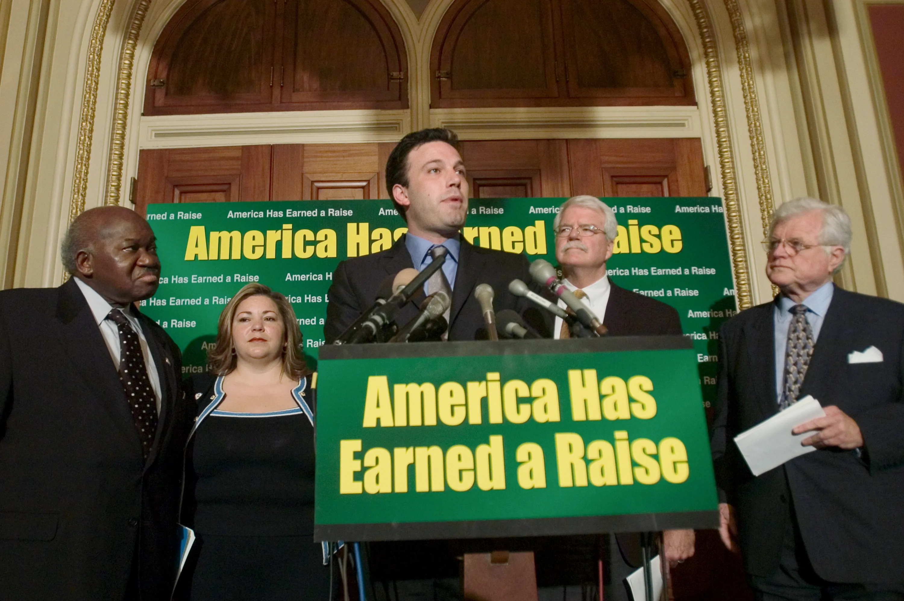 Affleck (C) speaks during a news conference on minimum wage as US Rep. Major Owens, (L) Rep. Linda Sanchez, (2nd-L) Rep. George Miller (2nd-R) and U.S. Sen. Ted Kennedy (R) and watch on April 29, 2004 at the US Capitol