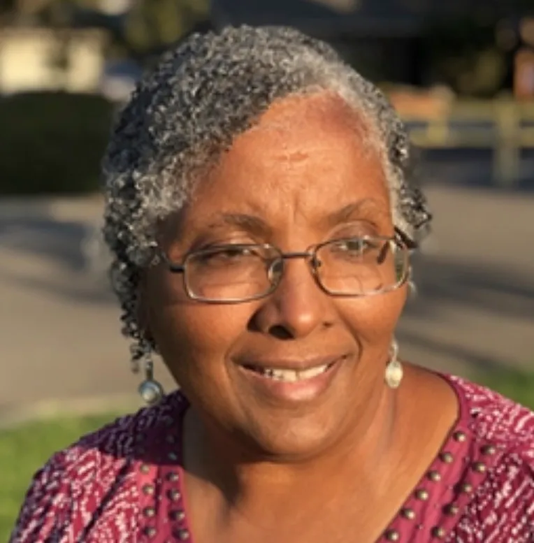 Connie Alexander smiling outdoors.