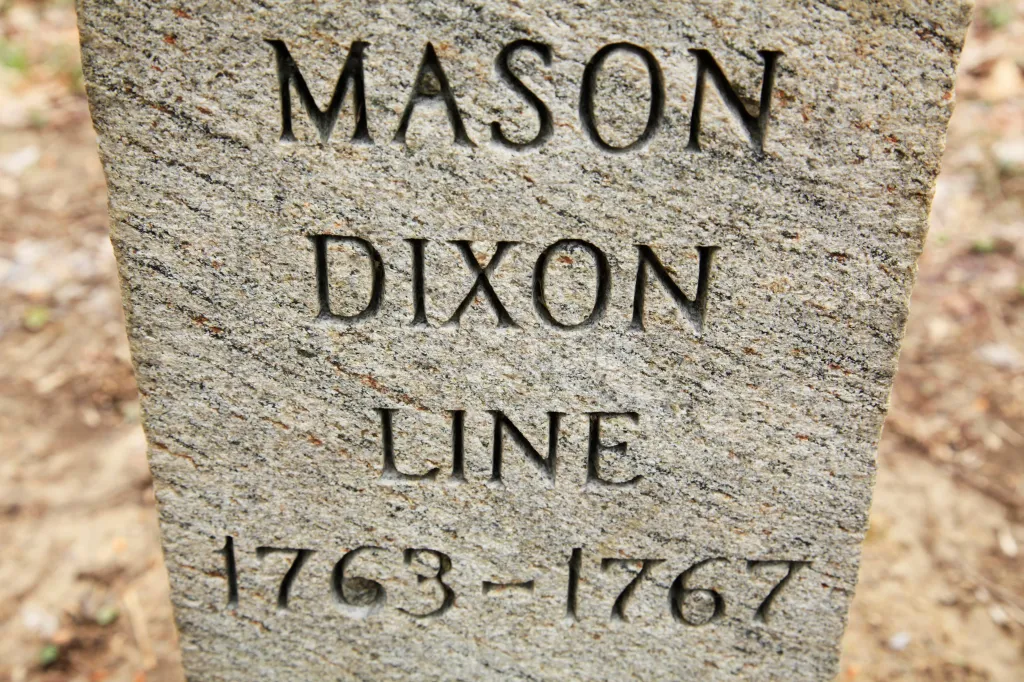 A stone marker with carved text reading 