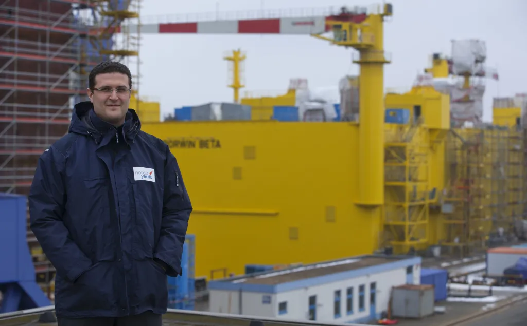Vitaly Yusufov, owner and manager of Nordic Yards, stands in front of the offshore platform BorWin beta.