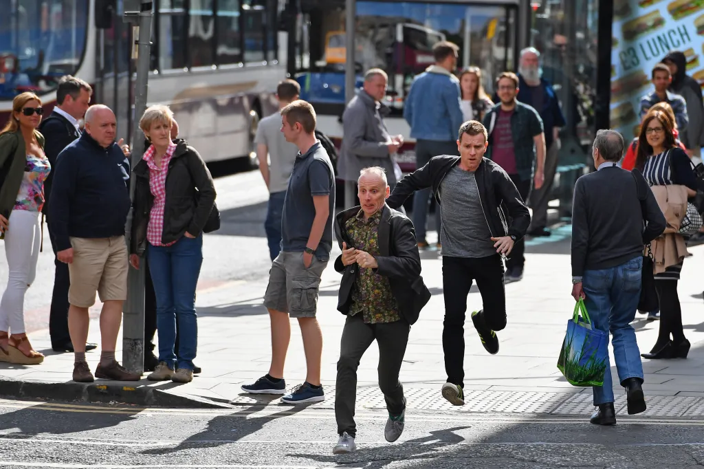 Actors Ewan McGregor and Ewan Bremner run on the set of the 