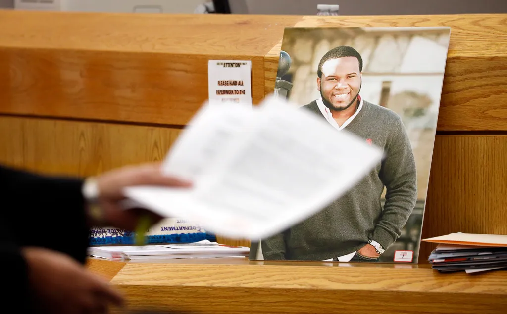 A photo of victim Botham Jean leaning against Judge Tammy Kemp's bench during the murder trial of former Dallas police officer Amber Guyger.