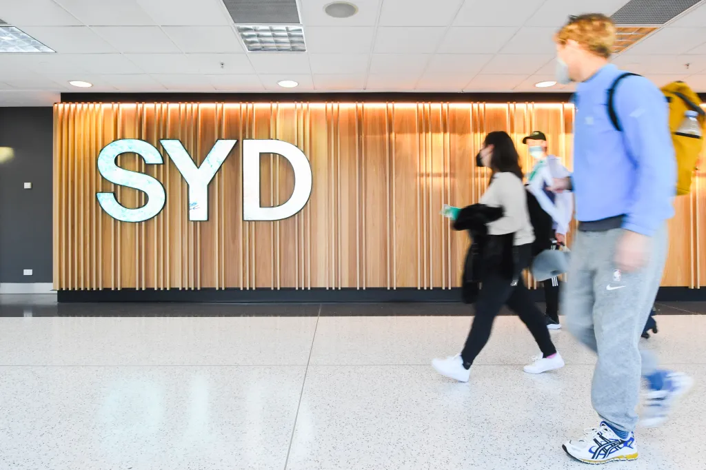 Passengers arrive at Sydney Airport following the easing of border restrictions.
