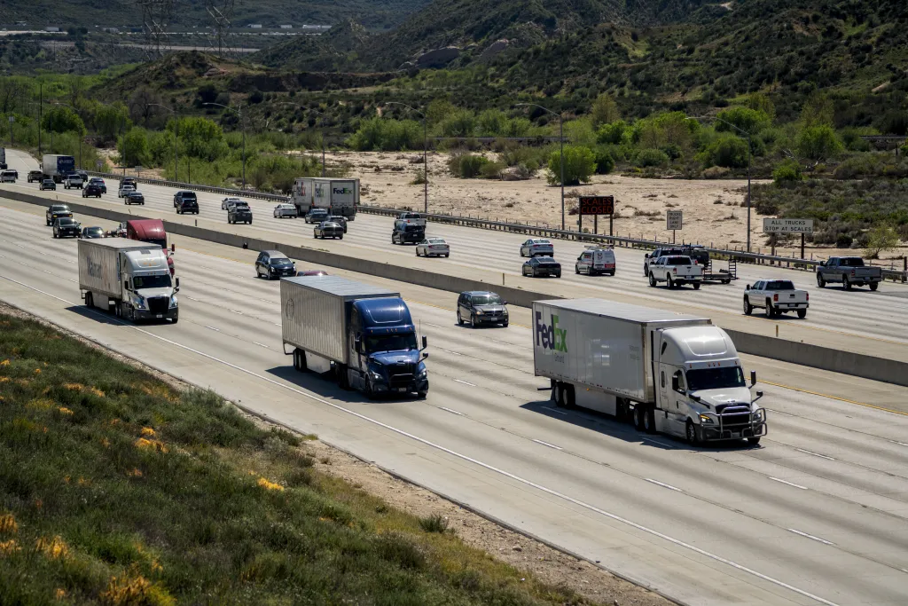 Trucks travel on Interstate 15 in Phelan, California, amid surging fuel prices.