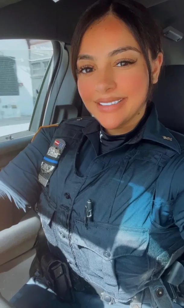 Officer Maria Delacruz sitting in a car in police uniform.