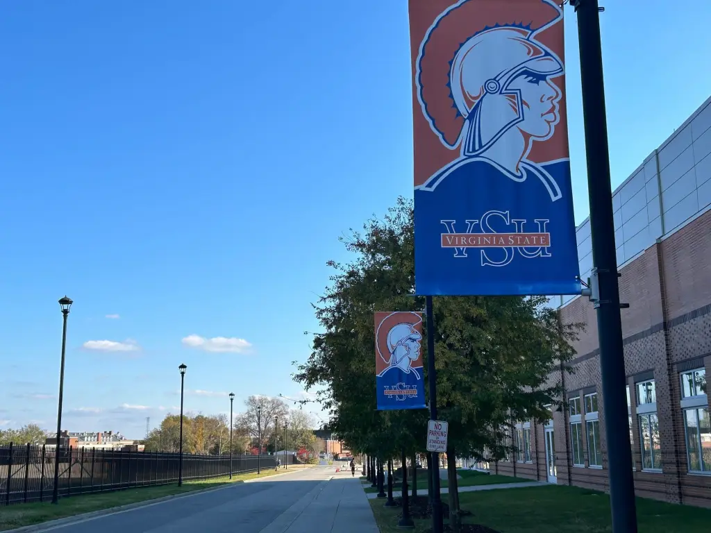 The campus of Virginia State University, featuring banners on light poles.