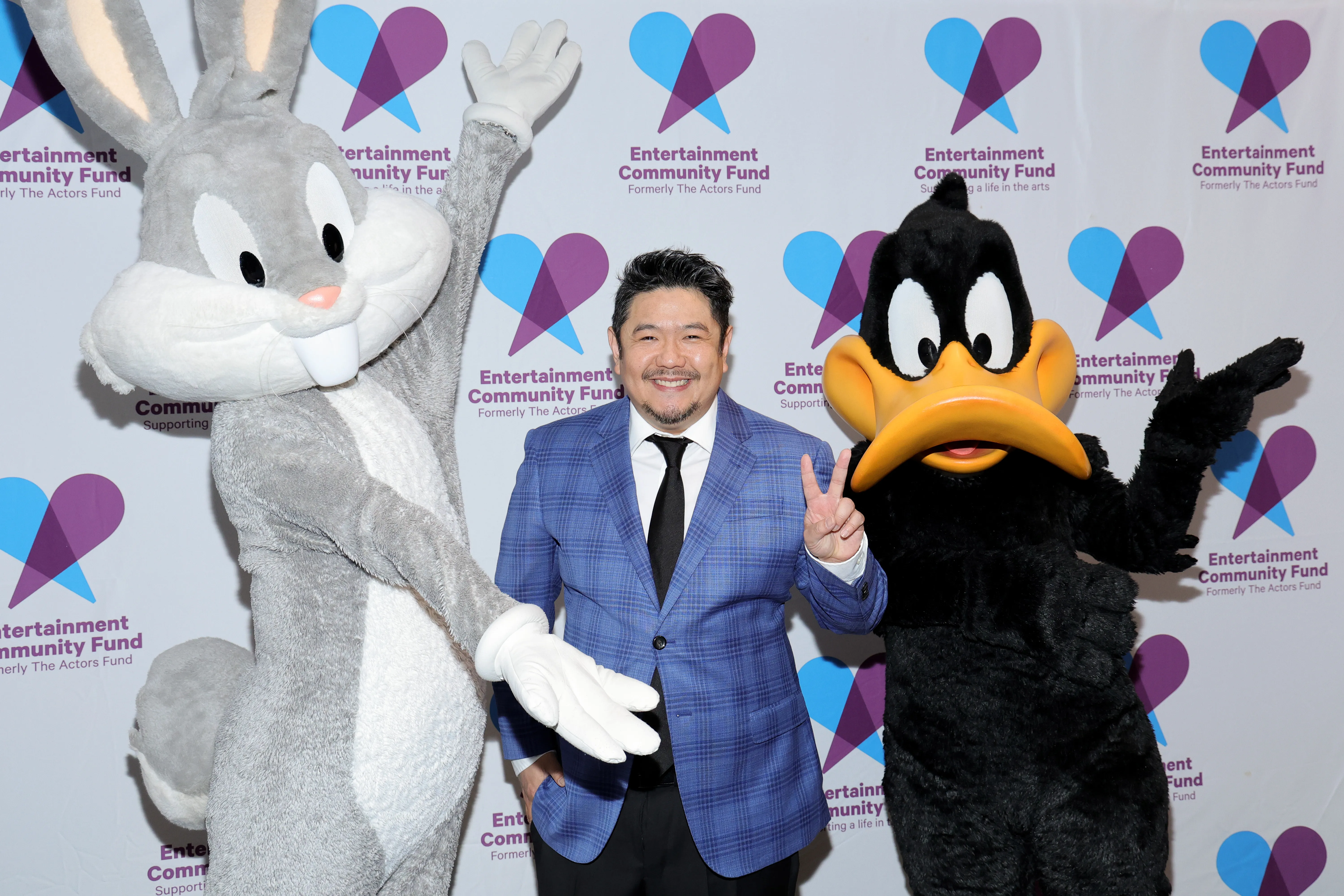 Eric Bauza poses with Bugs Bunny and Daffy Duck at the Entertainment Community Fund Gala.