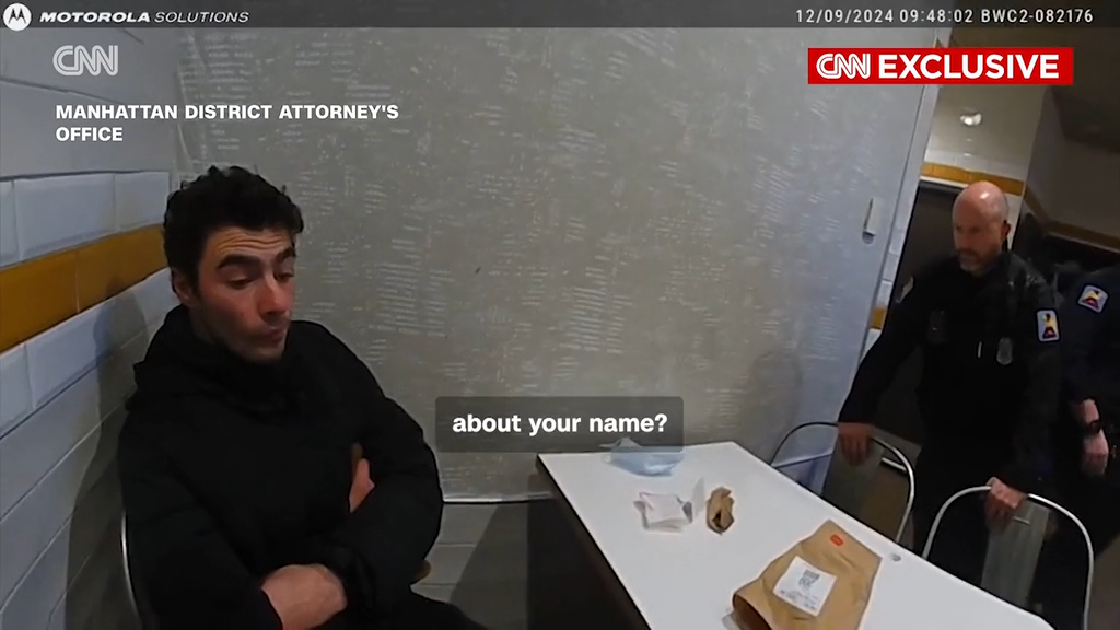 Police body camera footage shows officers questioning Luigi Mangione inside a McDonald's.