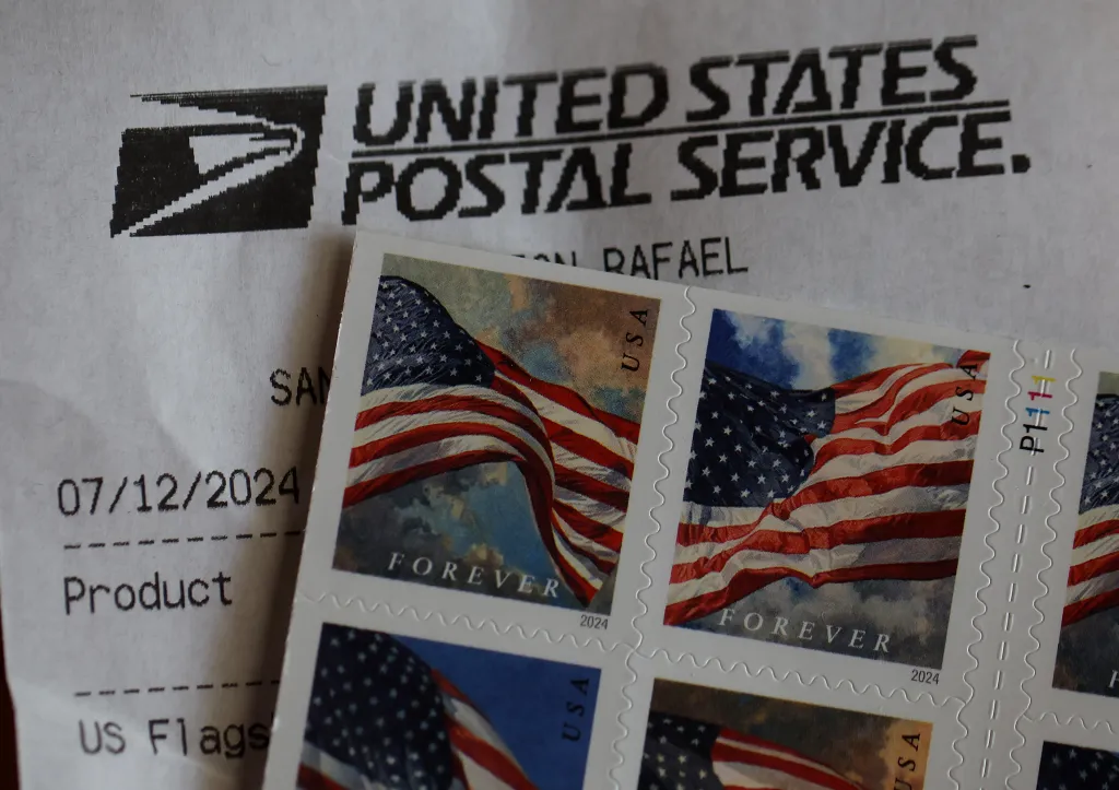 U.S. Postal Service forever stamps displayed on a document.