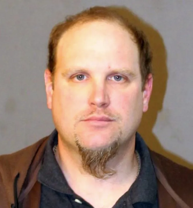 Mugshot of John D. Miller.