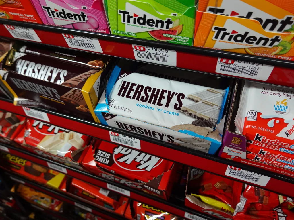 Hershey products sit on a store shelf.