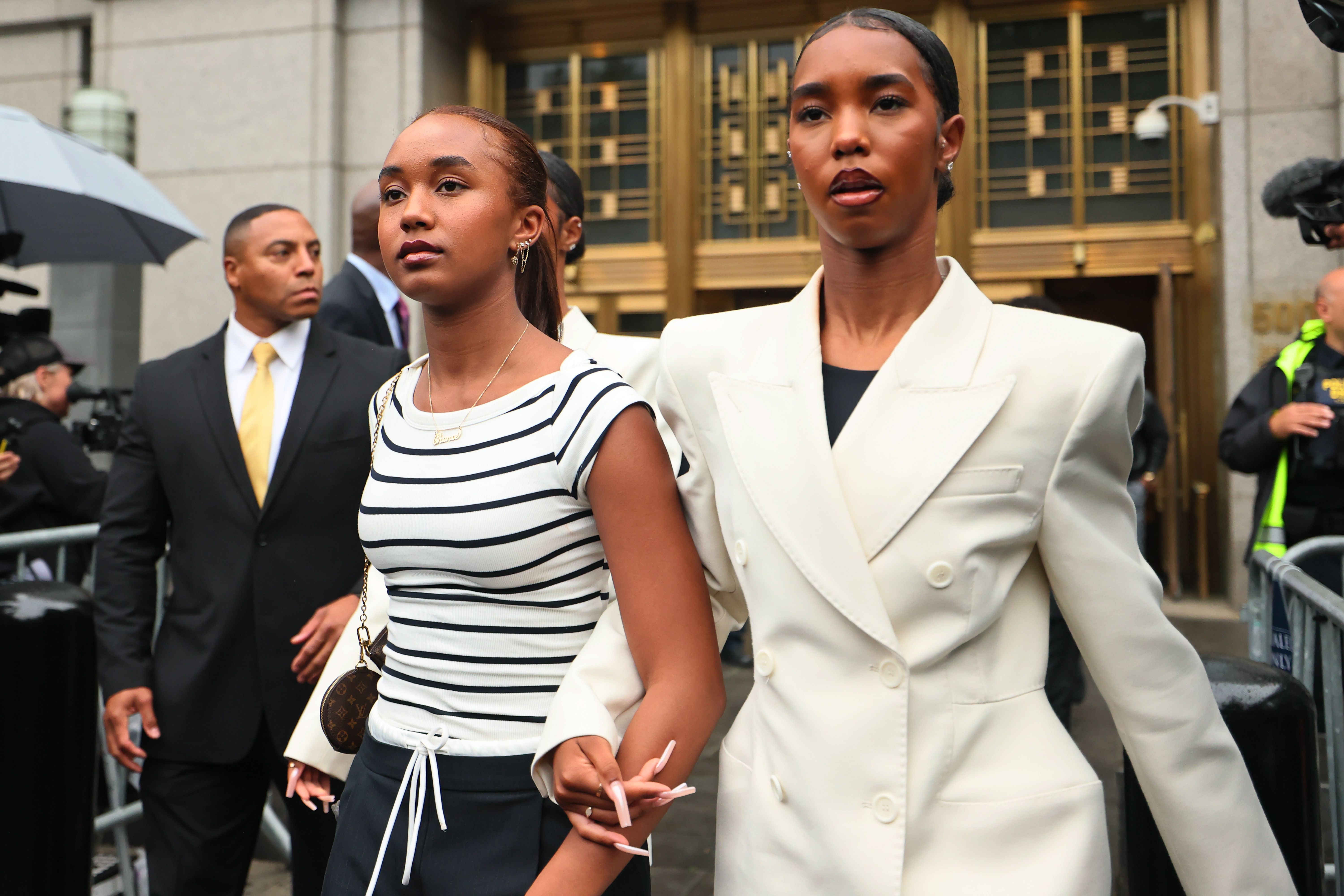 Chance Combs and D'Lila Star Combs leave Manhattan Federal Court during Sean Combs' trial.