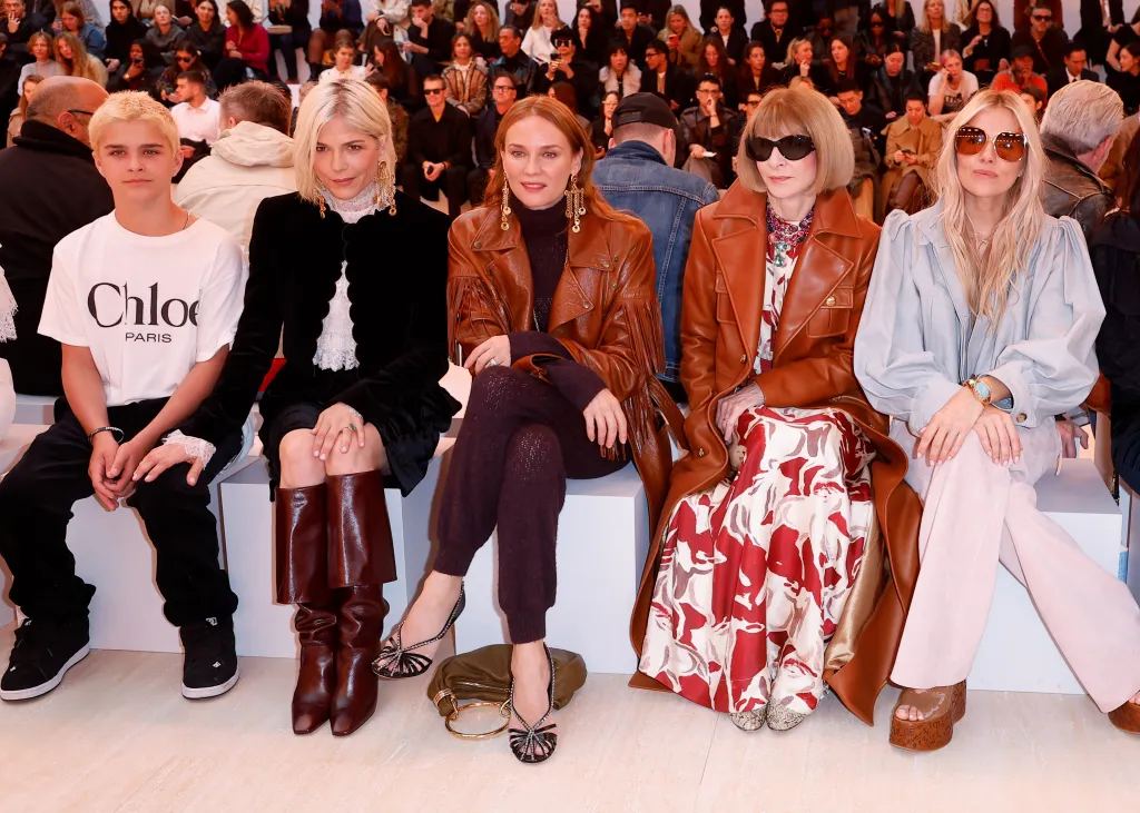 Arthur Saint Bleick, Selma Blair, Diane Kruger, Anna Wintour and Sienna Miller sit front row at a fashion show.
