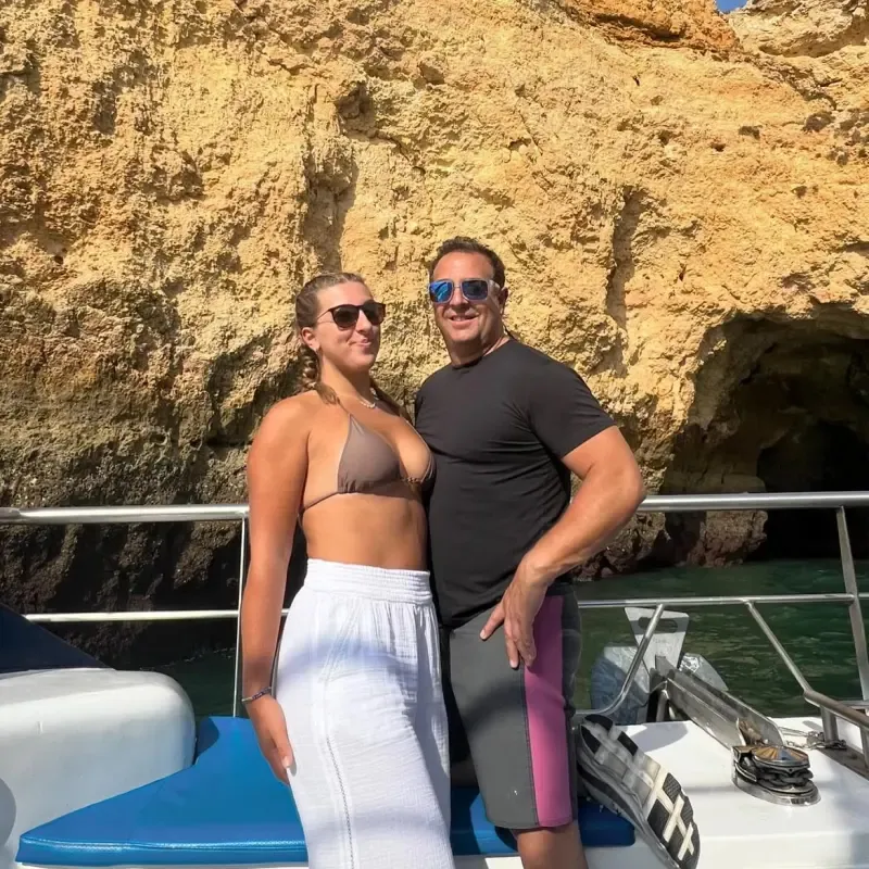Mangiameli on a boat with his daughter.