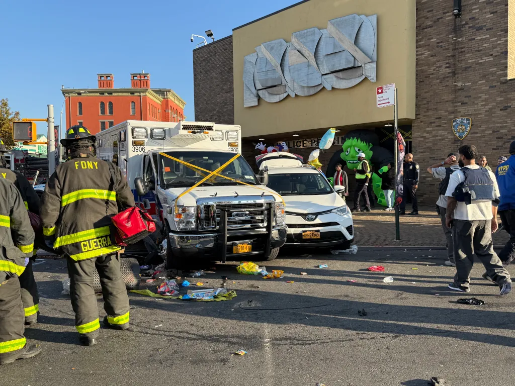 Emergency personnel and vehicles at the scene of a multiple-vehicle crash outside the NYPD's 83rd Precinct in Brooklyn.