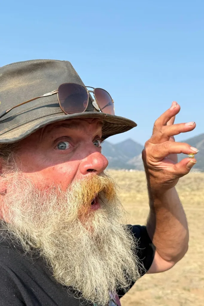 Diamond hunter Brian Busse holds the 6-carat gem found by Jack Pearadin and Michael Schumacher in Buena Vista, Colo.