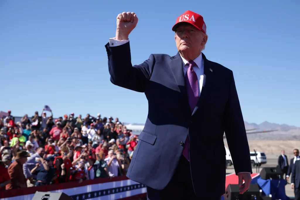 President Donald Trump raises his fist in front of a cheering crowd at a campaign rally in Bullhead City, Arizona.