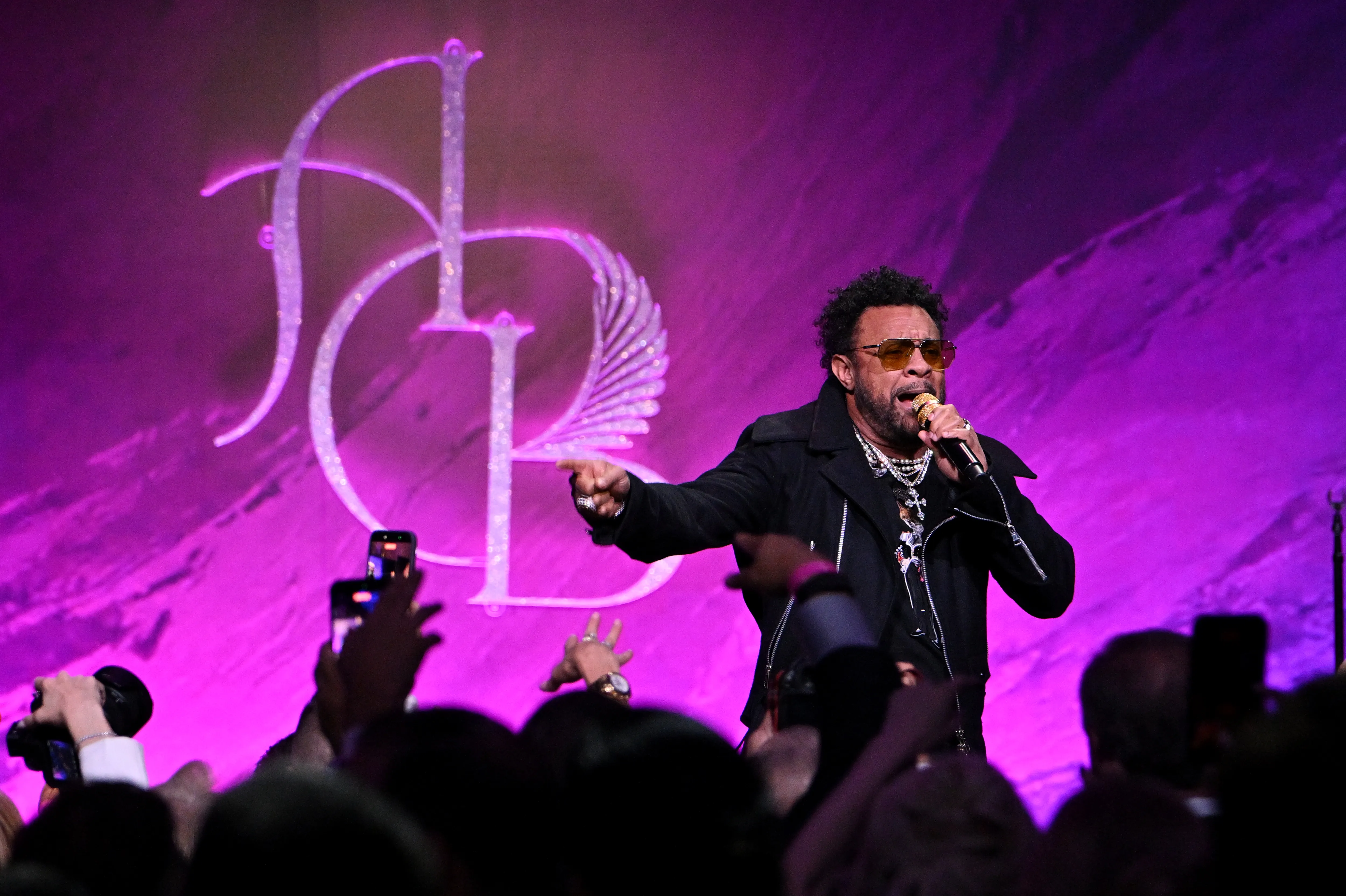 Shaggy performs onstage during the Angel Ball, pointing toward the audience with a microphone in hand.
