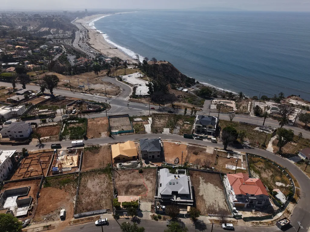 Aerial view of homes being rebuilt along the coast in Pacific Palisades, California.