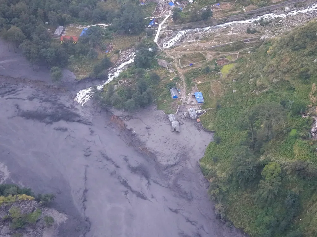 Nepali authorities urged villagers on Sunday to move to safer places after a flood in a river in the central part of the country swept away several houses and infrastructure