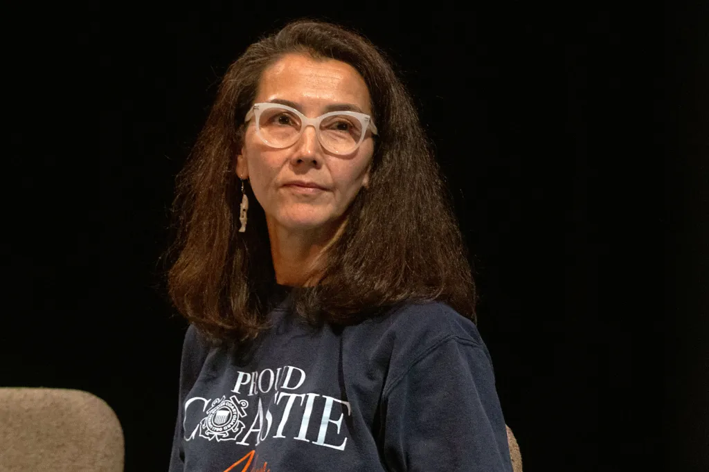 Former Representative Mary Peltola wearing glasses and a dark blue t-shirt.