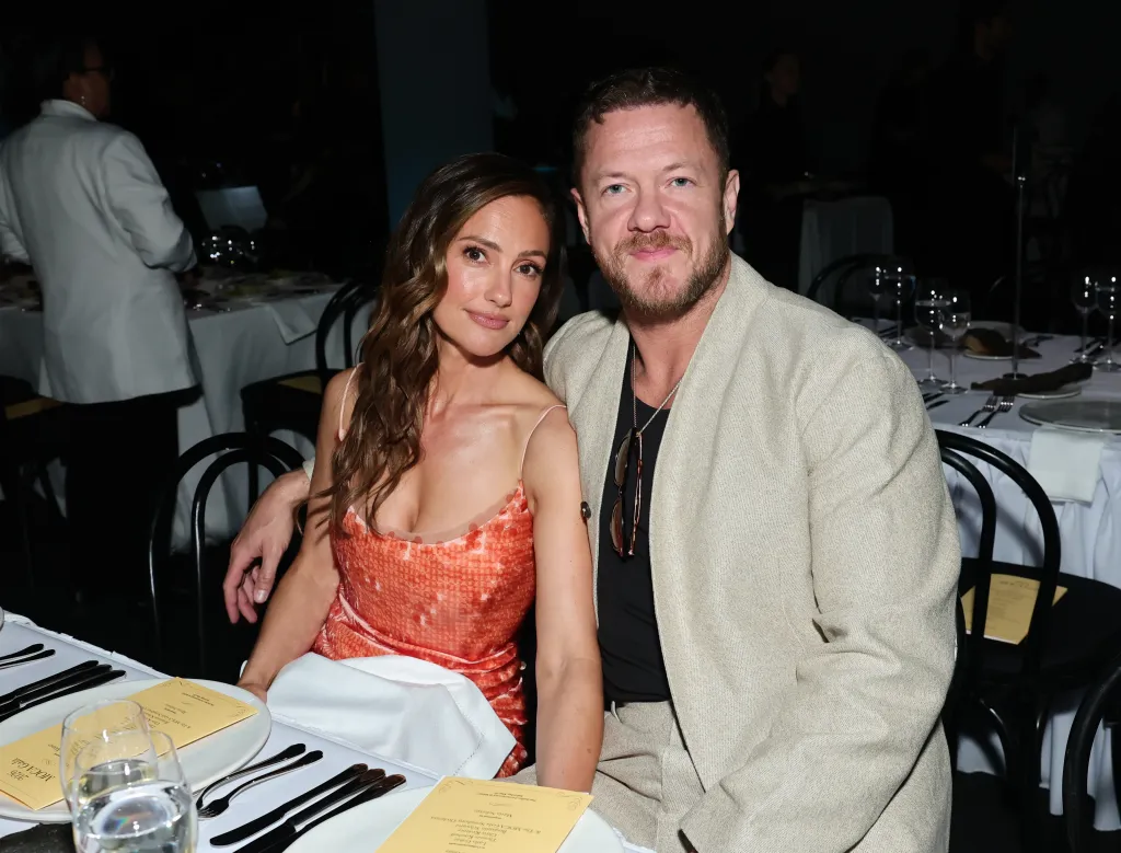 Minka Kelly and Dan Reynolds pose together at a table at the MOCA Gala.