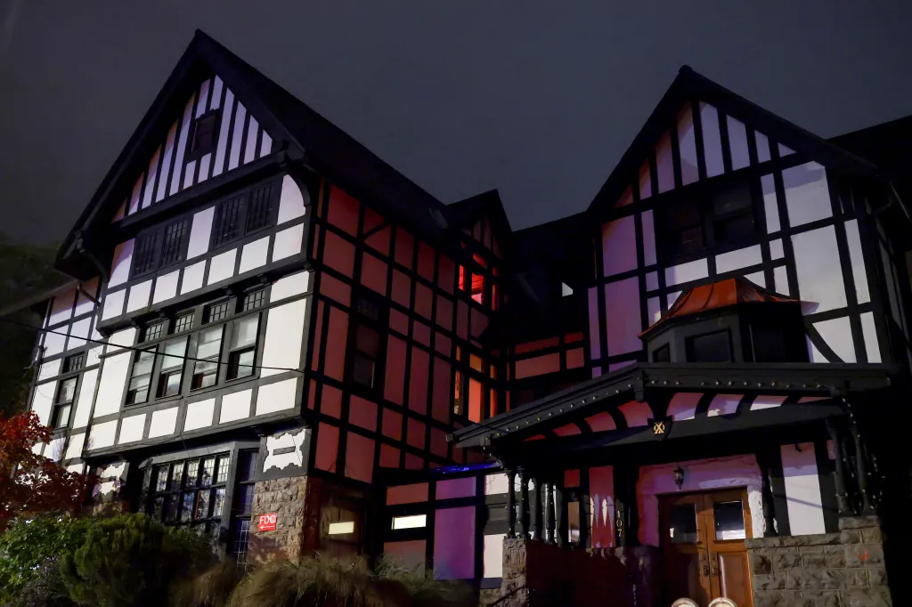 The Chi Phi fraternity house at Cornell University at night.