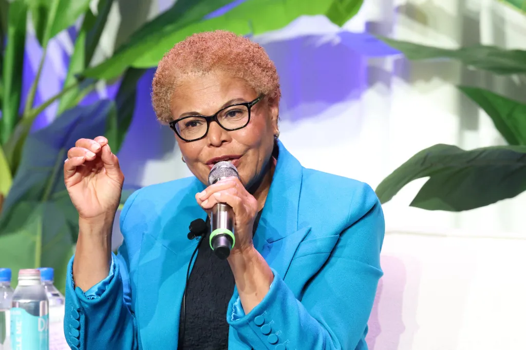 Los Angeles Mayor Karen Bass speaks into a microphone at a forum.