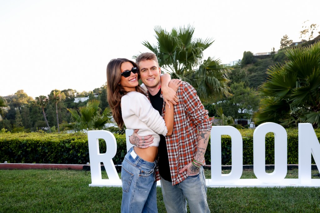 Kaia Gerber embracing her brother Presley Gerber at the RE/DONE 