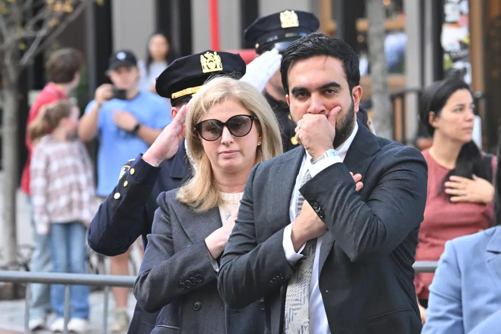 New York Mayor Zorhan Mamdani and Police Commissioner Jessica Tisch stand with relatives and police officers during the NYC Police Memorial Ceremony.