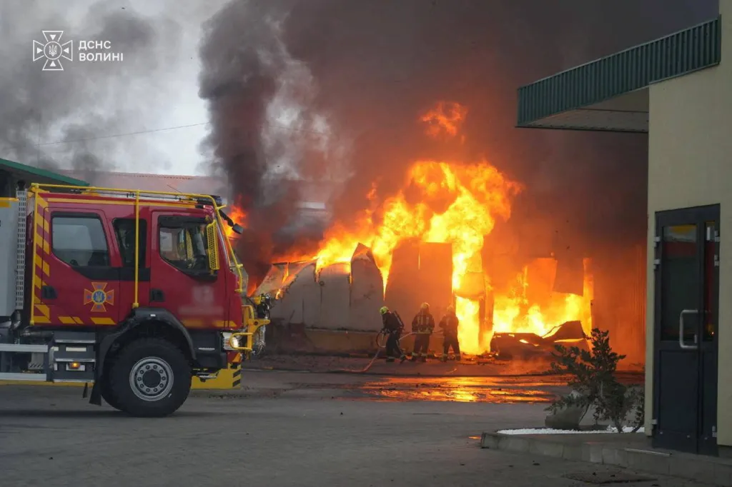 Firefighters battle a large fire and heavy smoke at a building following a drone strike in the Volyn region, Ukraine.