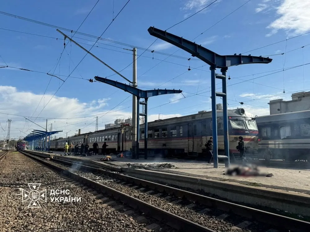 Emergency employees work at a railway station hit by a Russian drone strike in Dnipro, Ukraine.