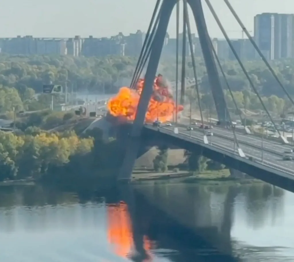 Fire and smoke erupt from an explosion on the North Bridge in Kyiv.