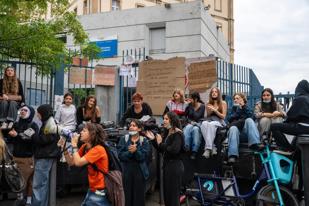 Students blockading the entrance of the Saint-Charles secondary school in Marseille, France, with cardboard placards.