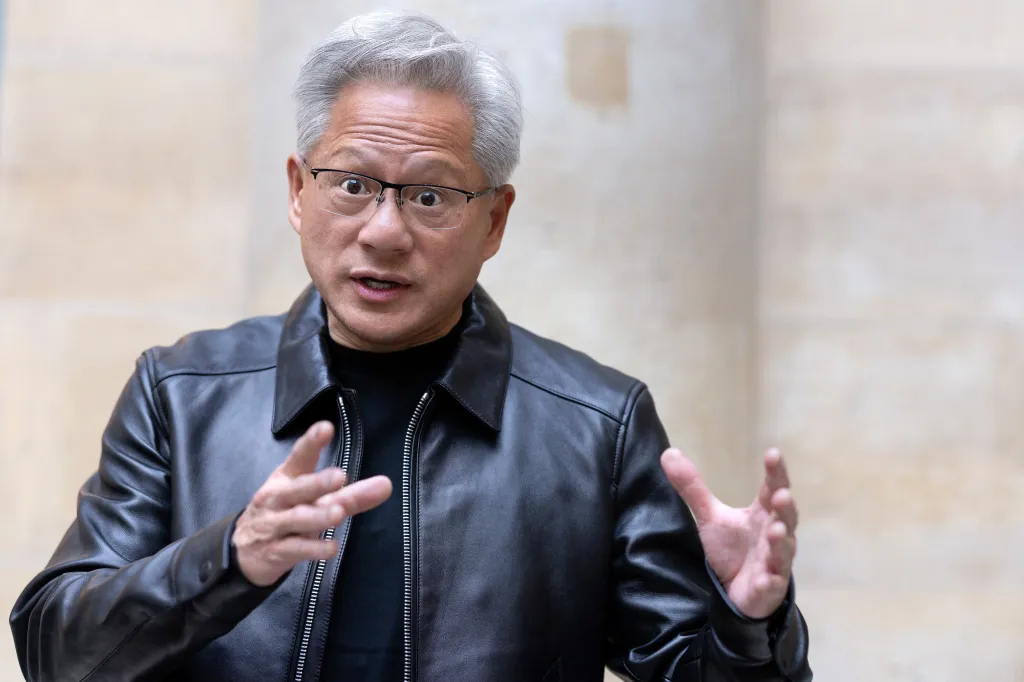 Nvidia CEO Jensen Huang gesturing during a press briefing.