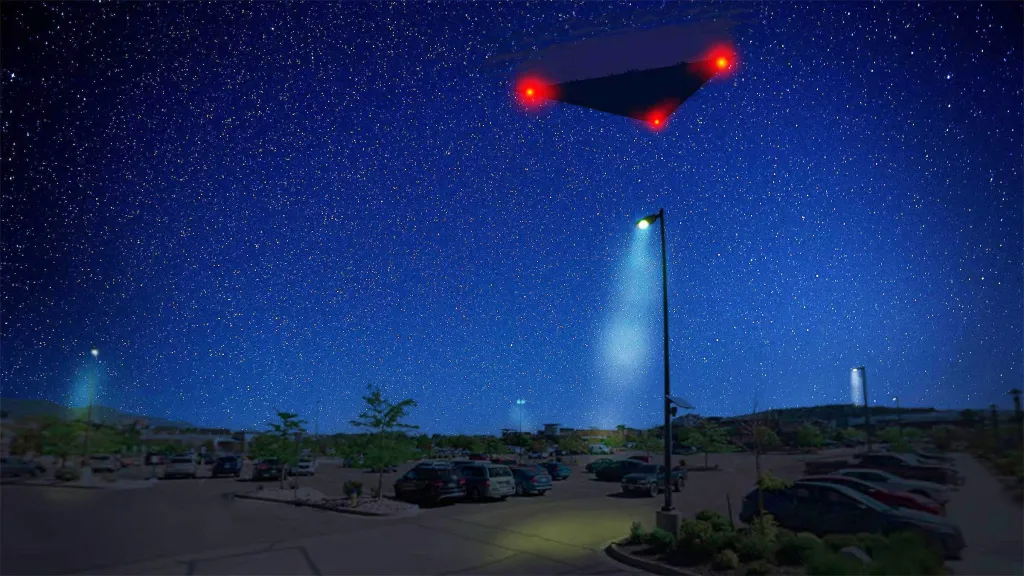 Digital illustration of a triangular UFO with red lights hovering in a star-filled night sky over a parking lot near Colorado Springs.