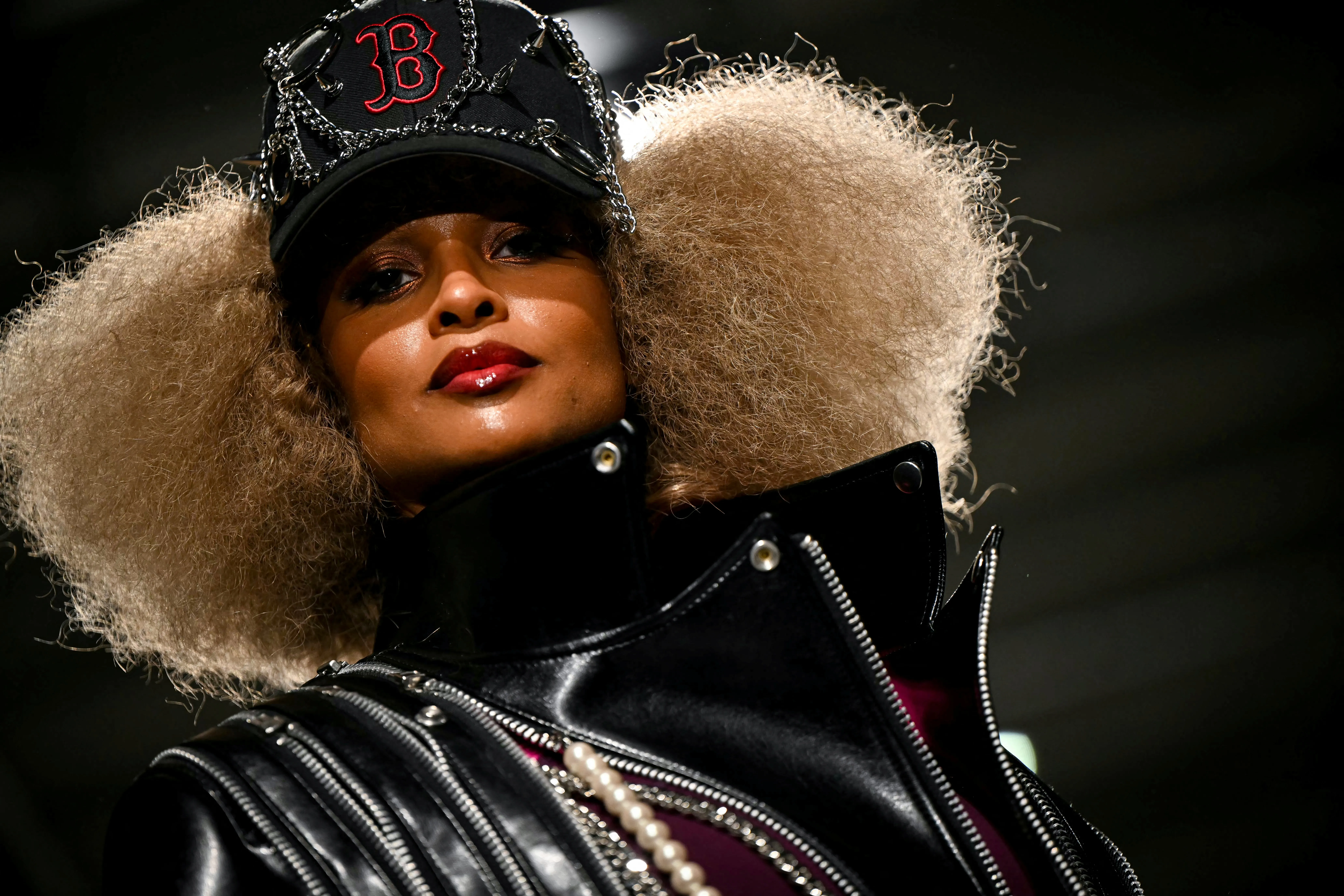 US singer Ciara presents a creation for Junya Watanabe Women's Spring/Summer collection fashion show in Paris, wearing a black cap with chains and a black leather jacket.