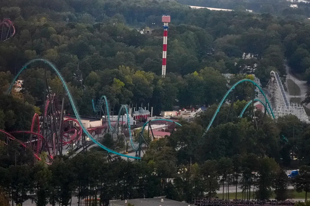 Attractions at Six Flags Over Georgia, surrounded by trees.