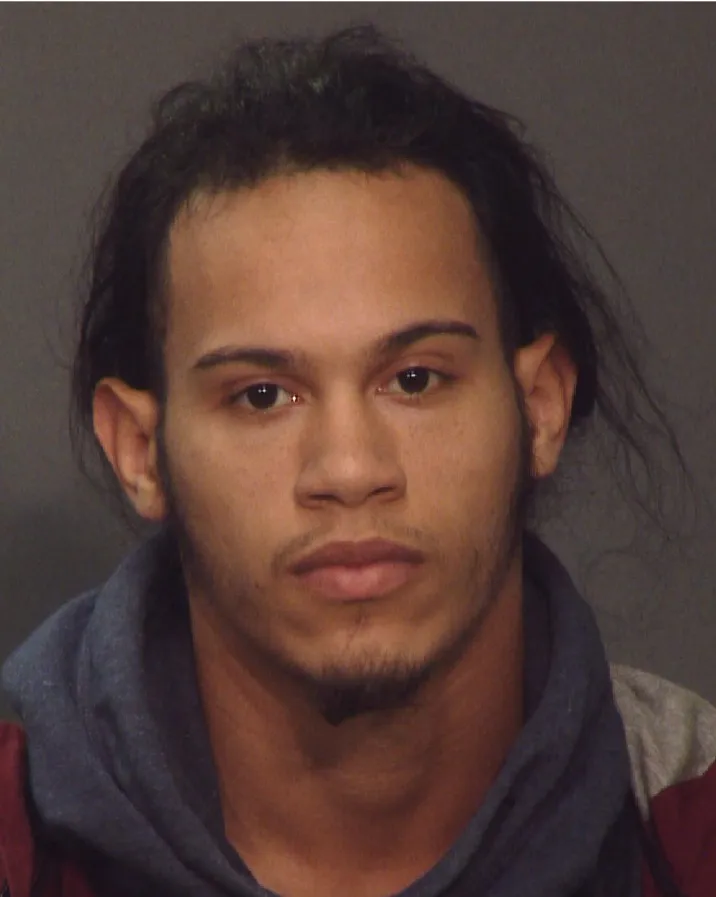 Police photograph of Angel Carrasco, wanted for homicide.